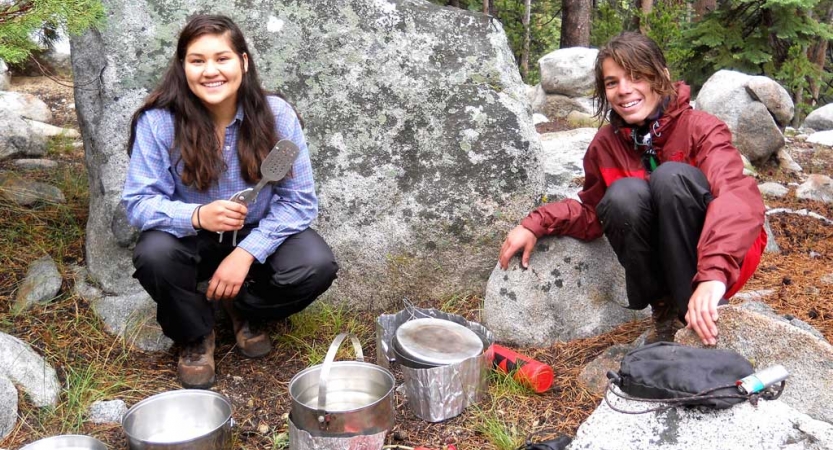 teens learn cooking skills on backpacking course